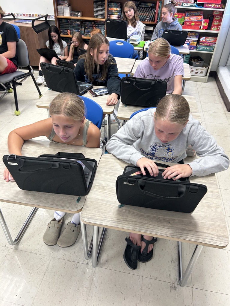 Students are collaborating on an Outsiders Escape Room.