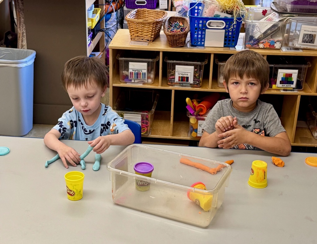 Students ae making letters with Play-doh.