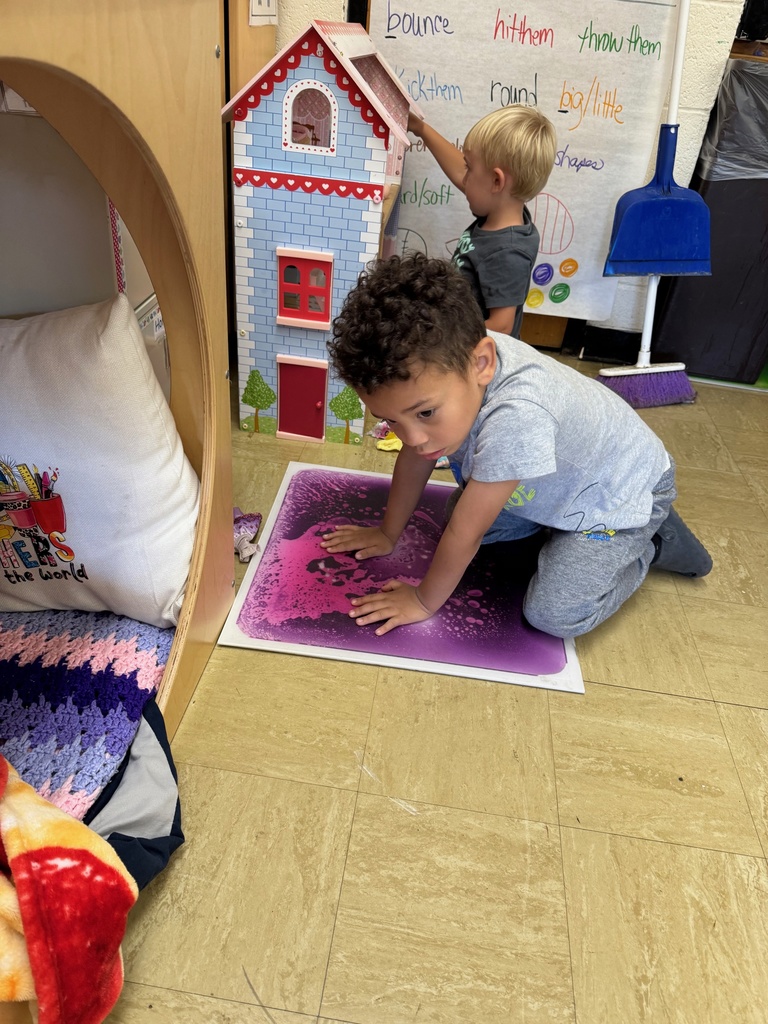 A student is on a sensory pad. 