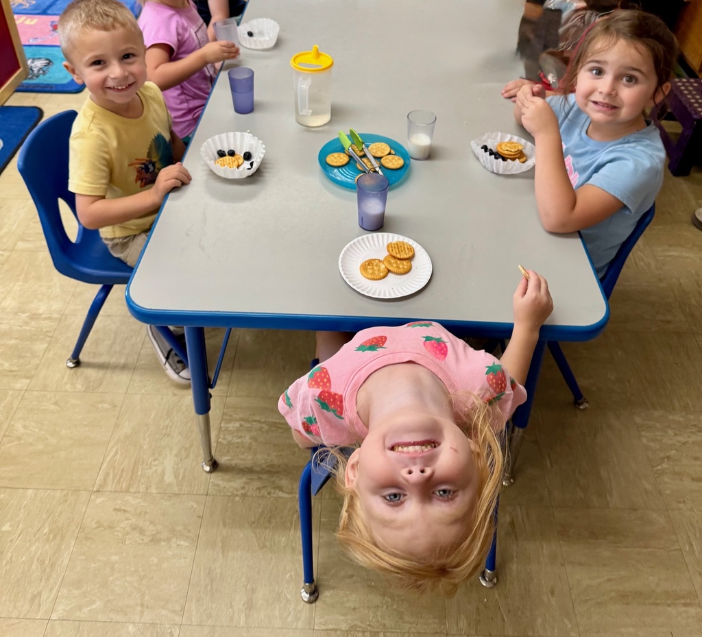 Students are eating a snack. 