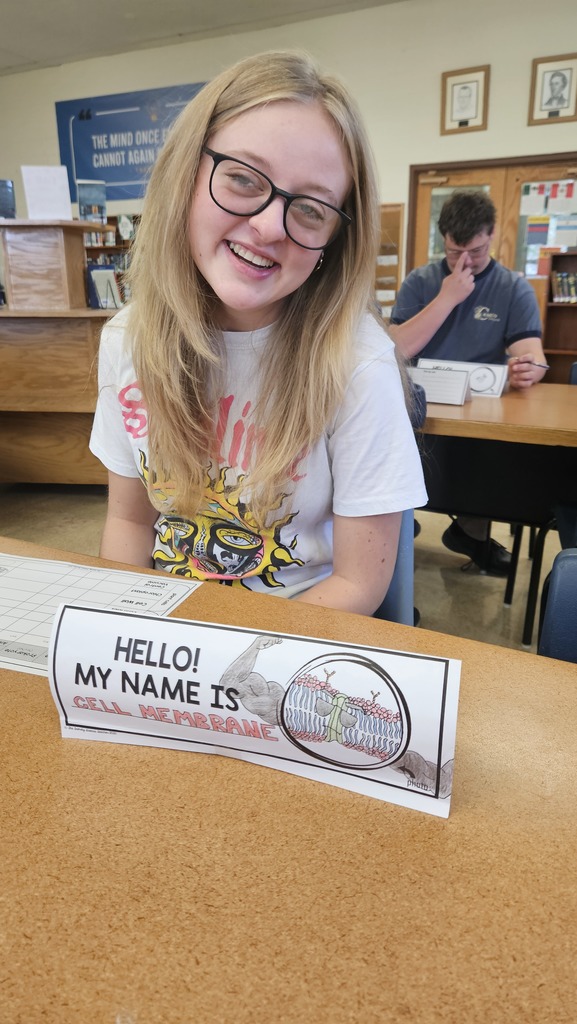 A student is acting as the cell membrane during Organelle speed dating.