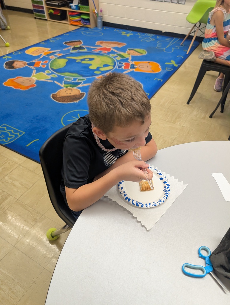 A student is eating apple pie. 