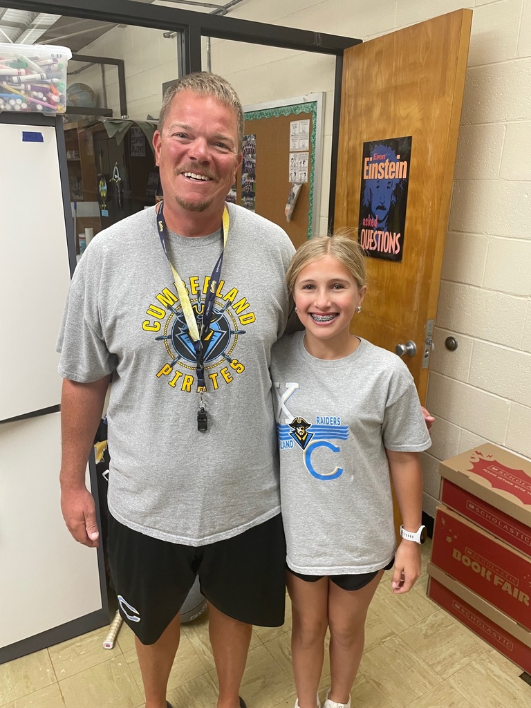 The teacher and the student each have grey shirts, black shorts, and tennis shoes.