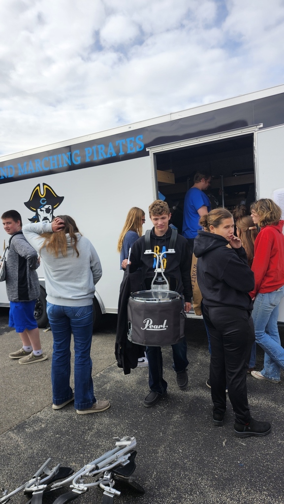 Members of the band are unloading their trailer after the last band completition.