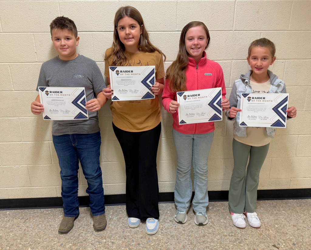 The picture is of the four students who were Raiders of the Month. They are holding their certificate.