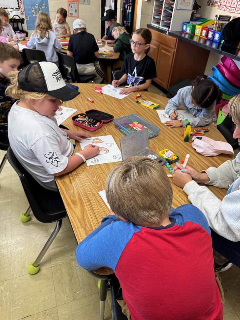 The class is coloring their turkeys. 