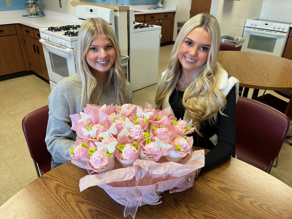 The bakers of the Butterfly Boquet are showing their display. 