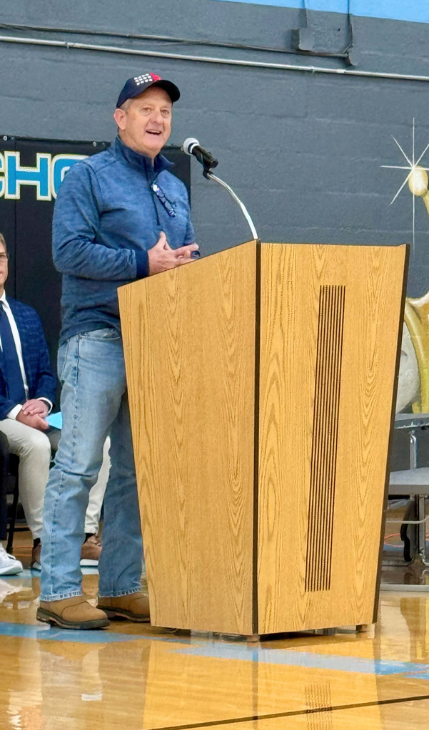 The keynote speaker is addressing the crowd at the program.