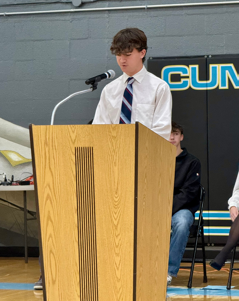 The student council president is emceeing the program.