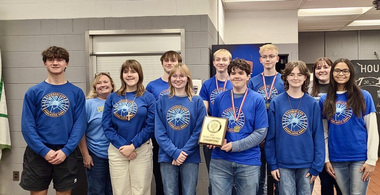 Picture is the scholastic ball team. They are holding their first place trophy.
