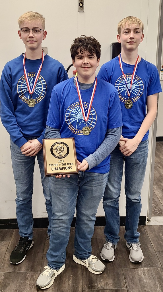 Picture are the three tournament players. They are wearing their tournament medals.
