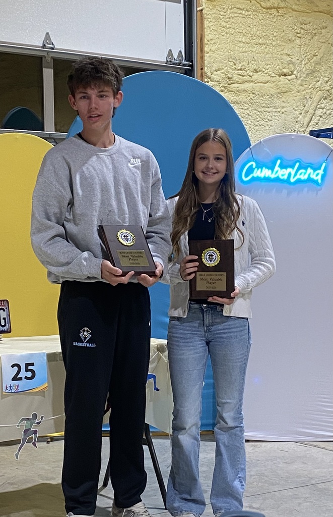 The two individuals who won the MVP awards are holding their plaques.