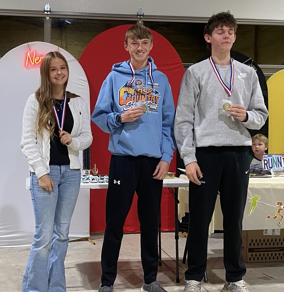 The two individuals who won the Knights of the Roundtable awards are holding their plaques.