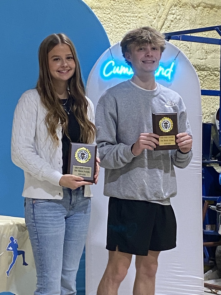 The two individuals who won the Mental Attitude awards are holding their plaques.