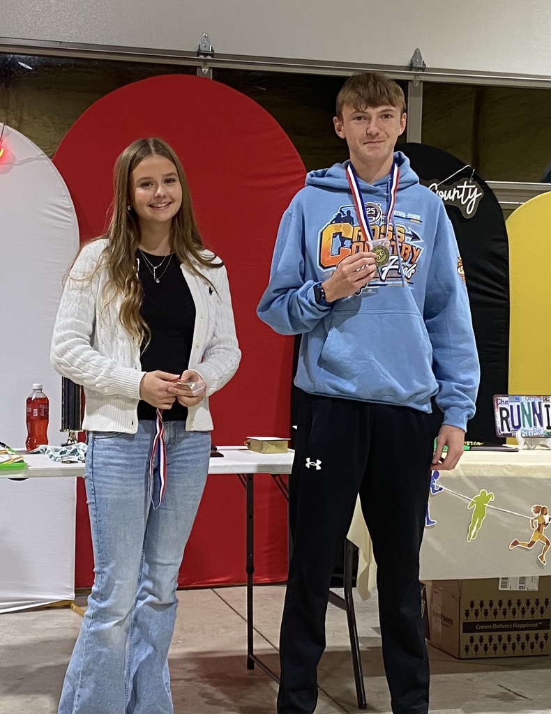 The two individuals who won the Pirate awards are holding their plaques.