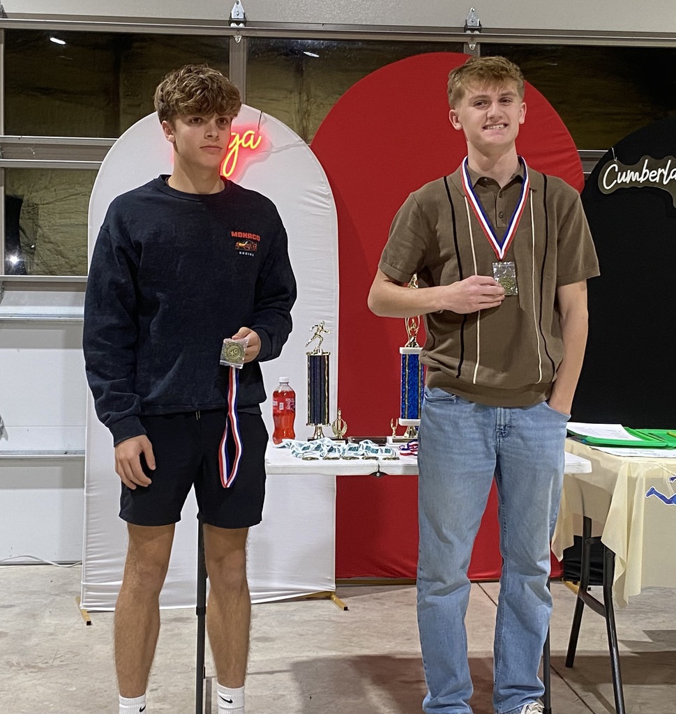 The two individuals who won the Outstanding Open Runner awards are holding their plaques.