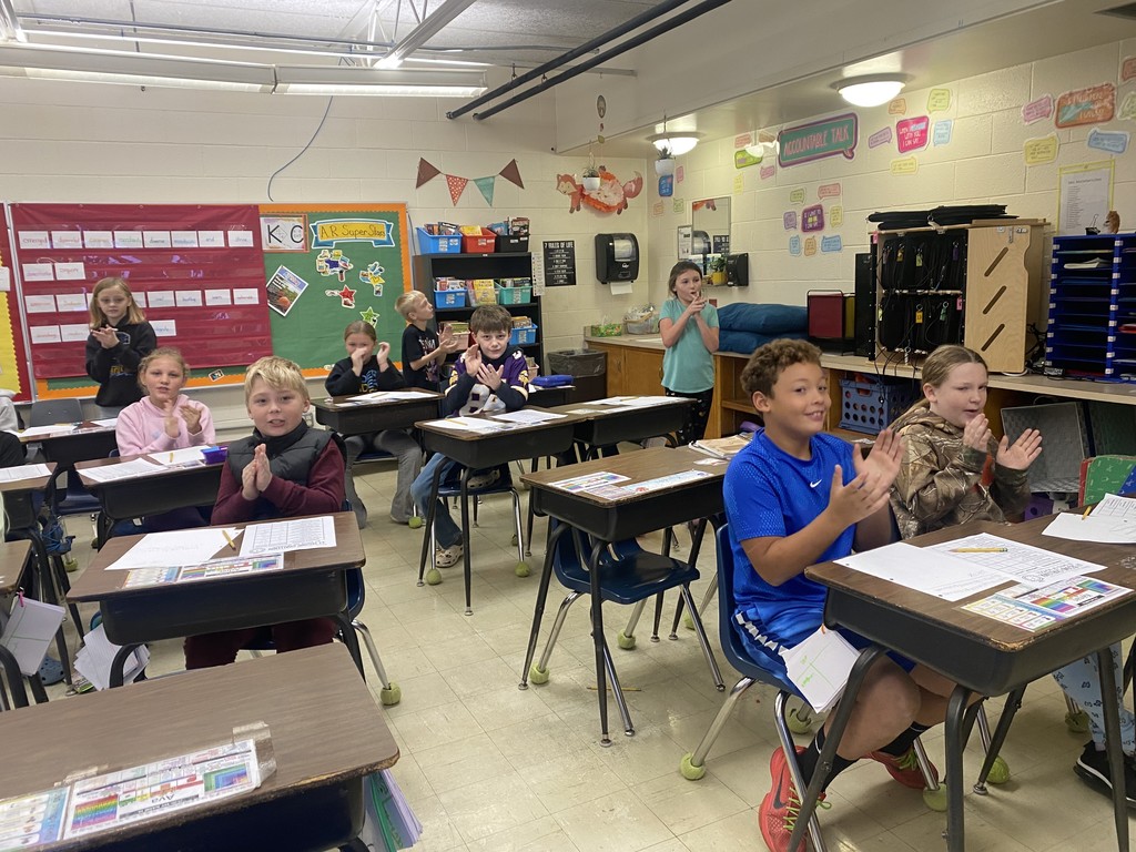 Students are seeing how many times they can clap in 67 seconds. 