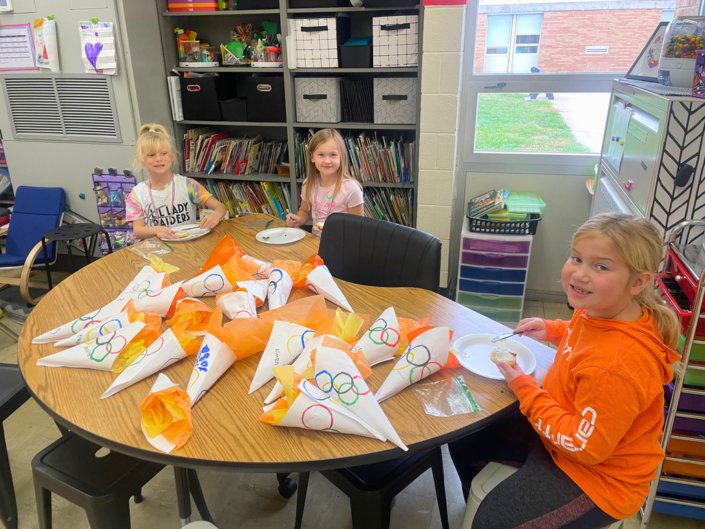 Students are eating a snack. 