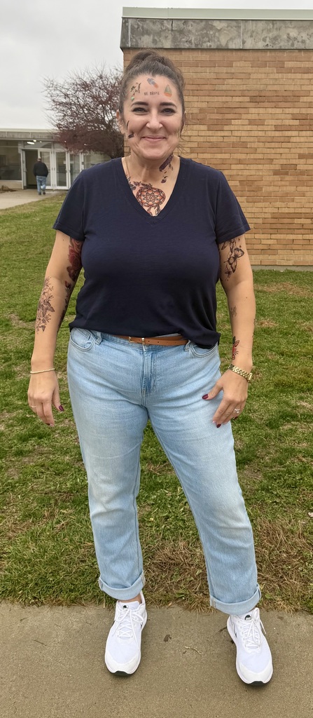 The principal is displaying her temporary tattoos. 