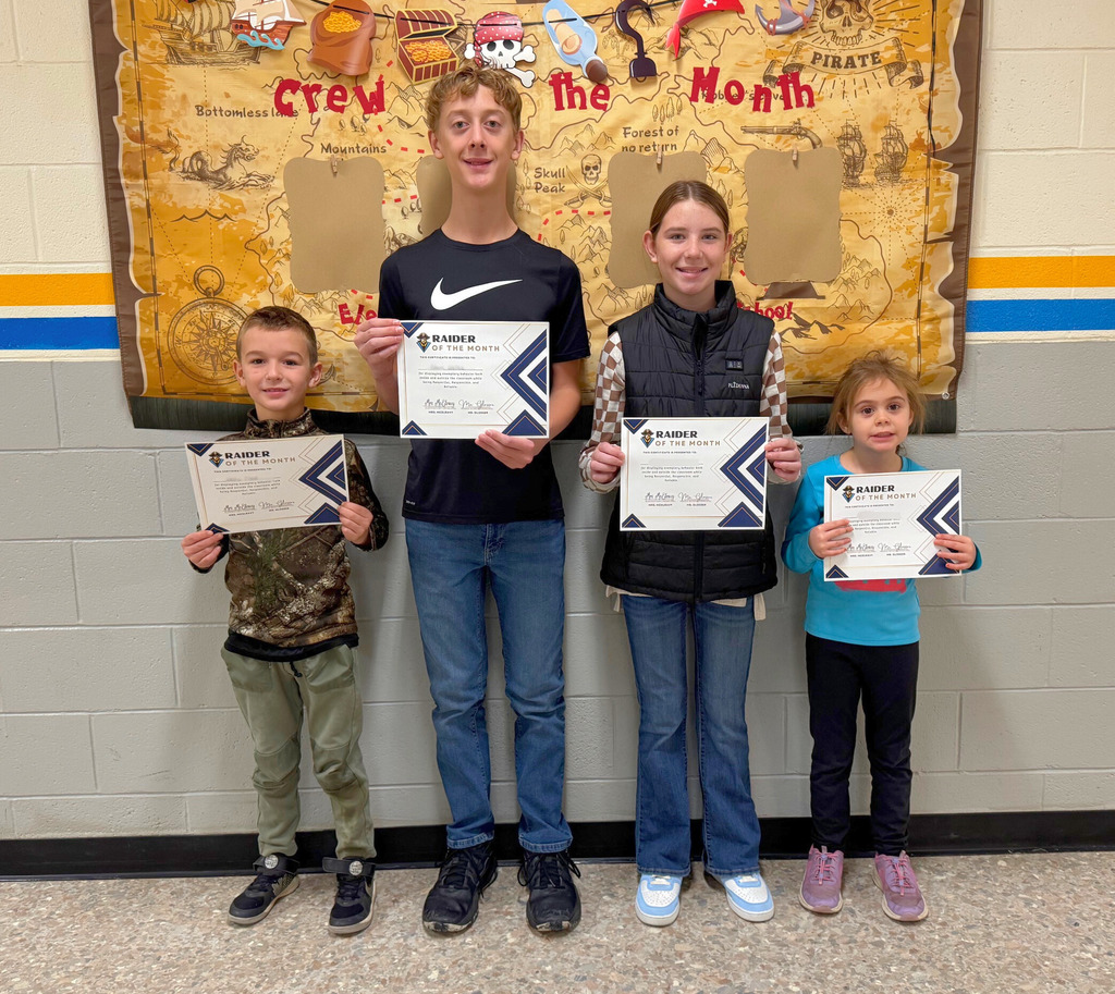 Pictured are the four Raiders of the Month. They are holding their certificates. 