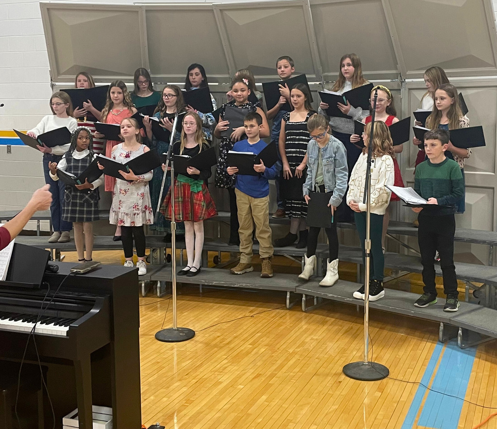 Pictured is the 5-6 grade choir prior to their concert. They are standinf on the risers ready to perform. 