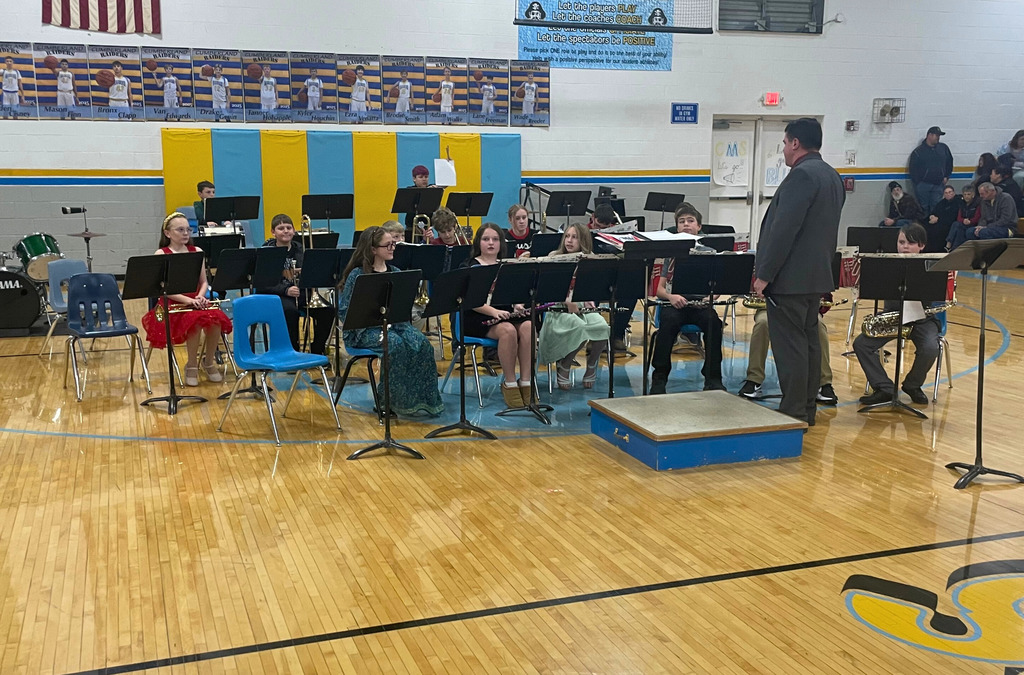 Pictured is the 6th grade band prior to their concert. They are sitting in their chairs ready to perform. 