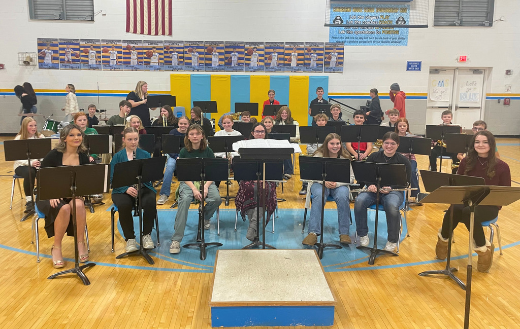 Pictured is the 7-8 grade band prior to their concert. They are sitting in their chairs ready to perform. 