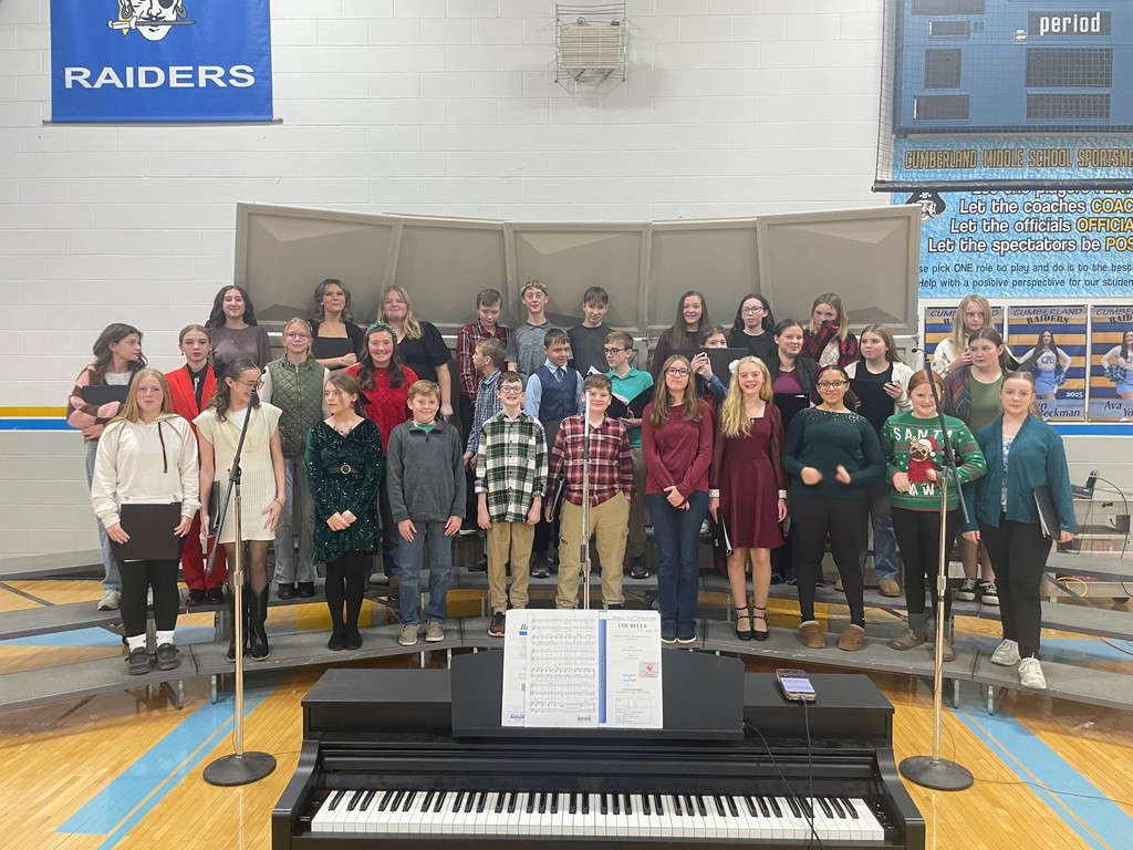 Pictured is the 7-8 grade choir prior to their concert. They are standinf on the risers ready to perform. 