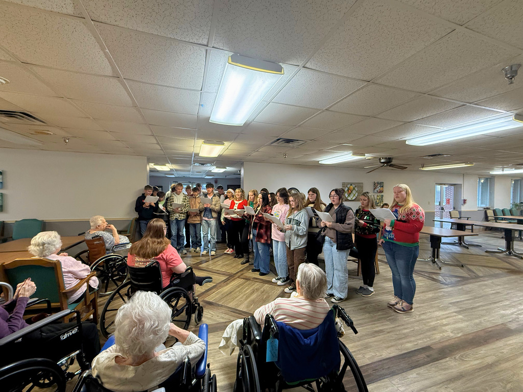 Students are caroling for the residents at a nursing home. 