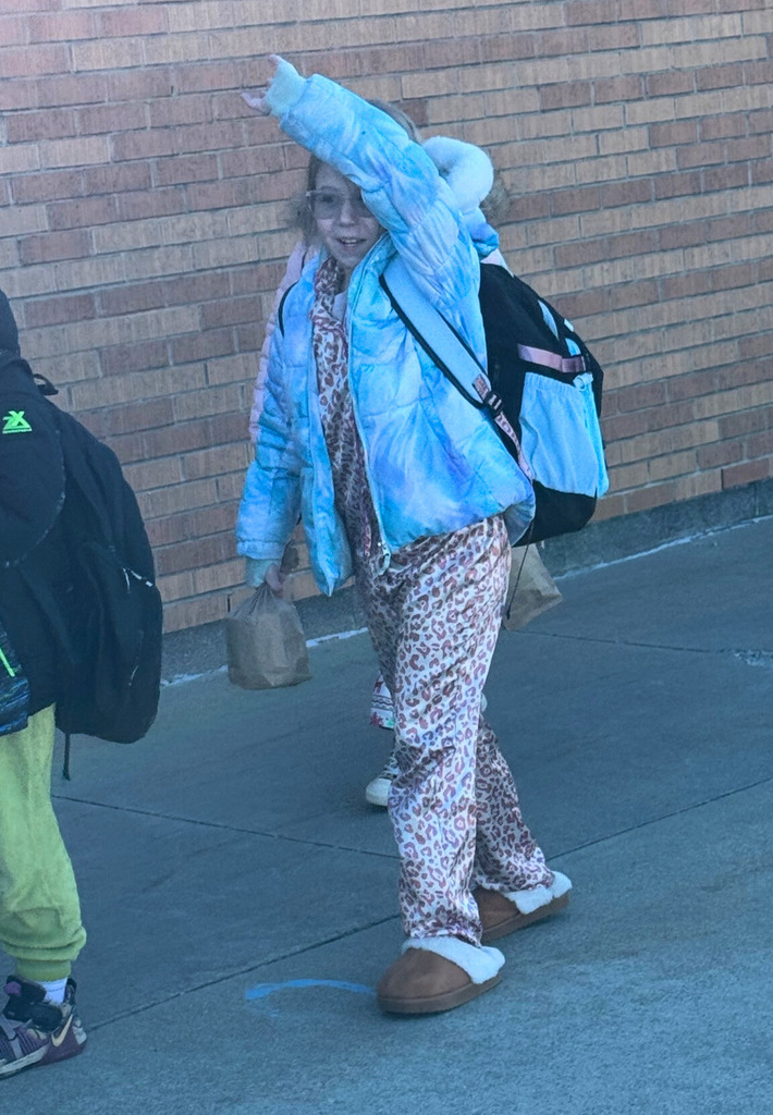 Students are waving to the visitors. 