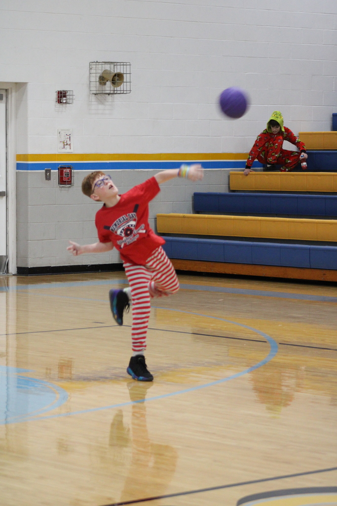 A student is throwing a ball.