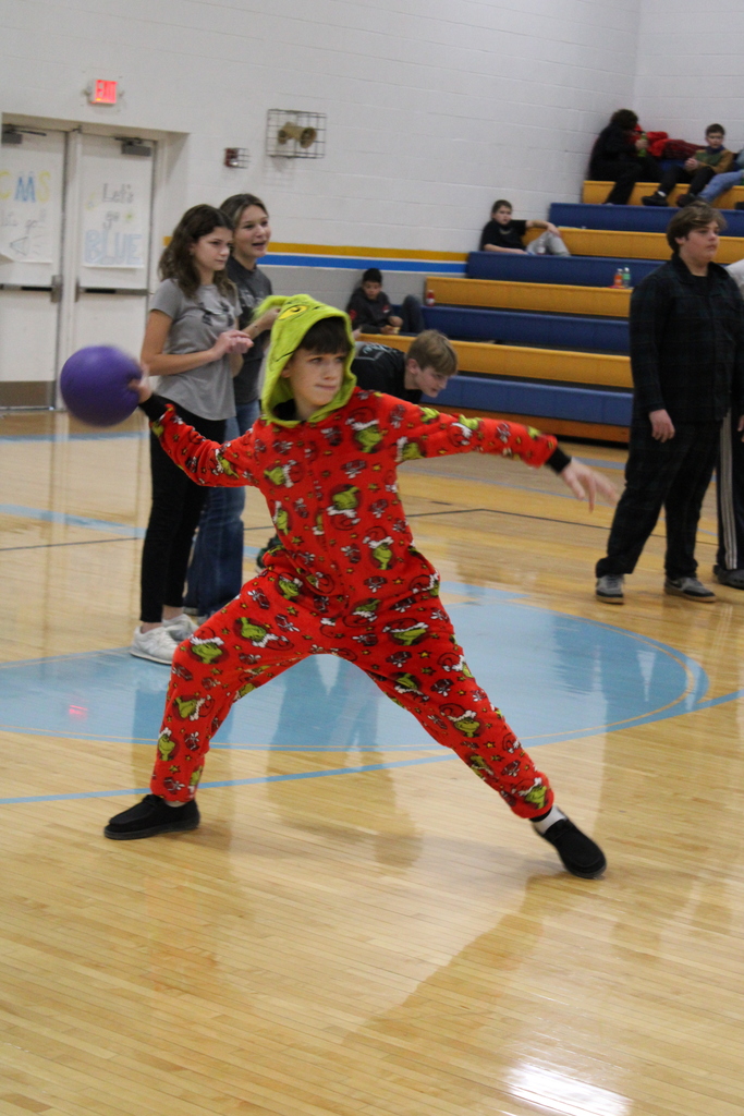 A student is throwing a ball. 