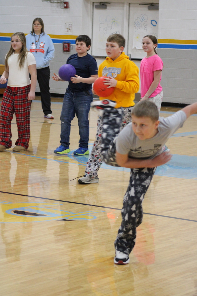 A student is throwing a ball. 