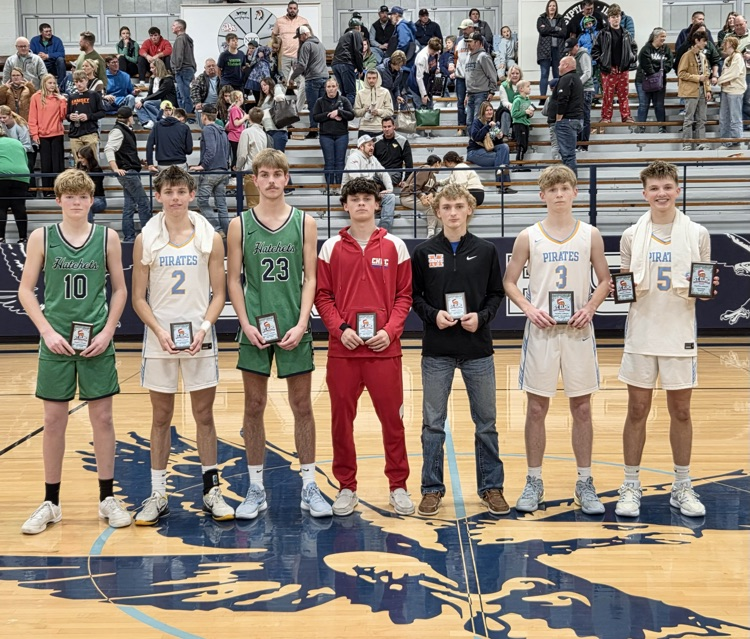 pictured is the tournament team each holding their trophy. There are seven players on the tournament team.RM is also holding his defensive award trophy.