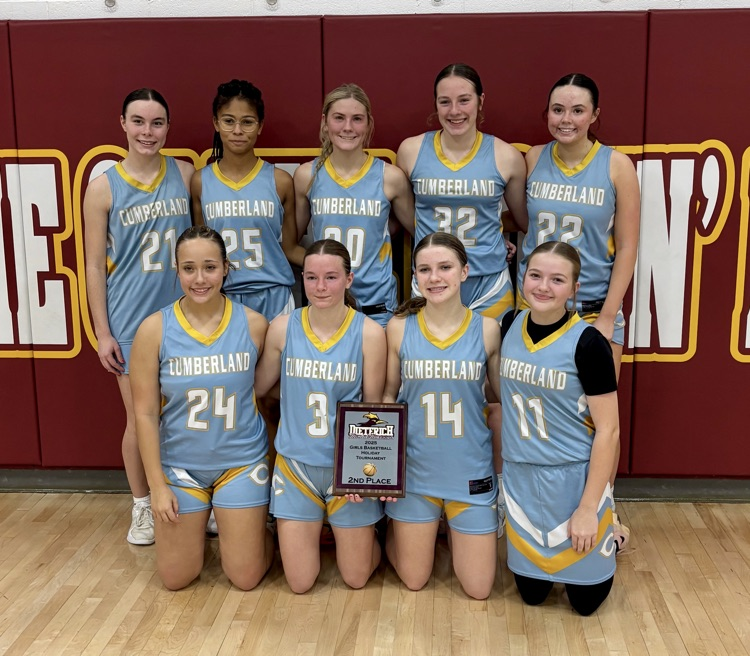 The team picture is in two rows. The first row is kneeling. They are holding the second place trophy.