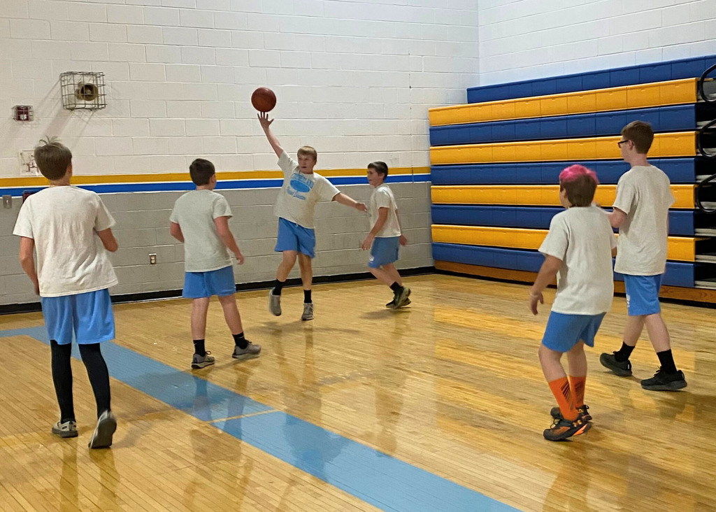 Teams are playing 3-on-3 basketball games. They are playing in the gym which is shaded in yellow and blue colors.