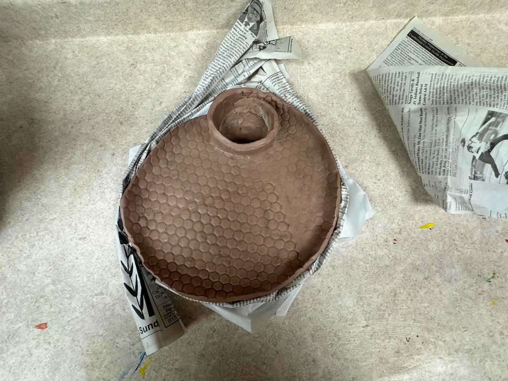 This is an example of a chip and dip bowl. It has a small spiral bowl inside of the larger portion. 