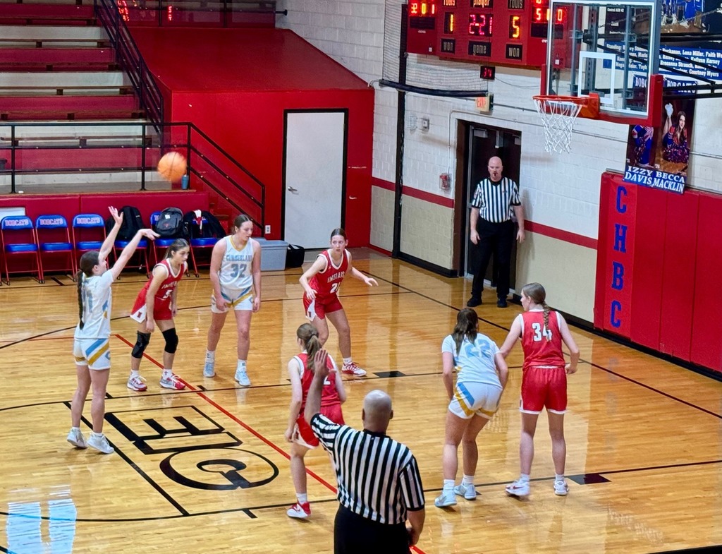 The game is in progress. The home team, Cumberland, has a girl shooting a free throw.. 