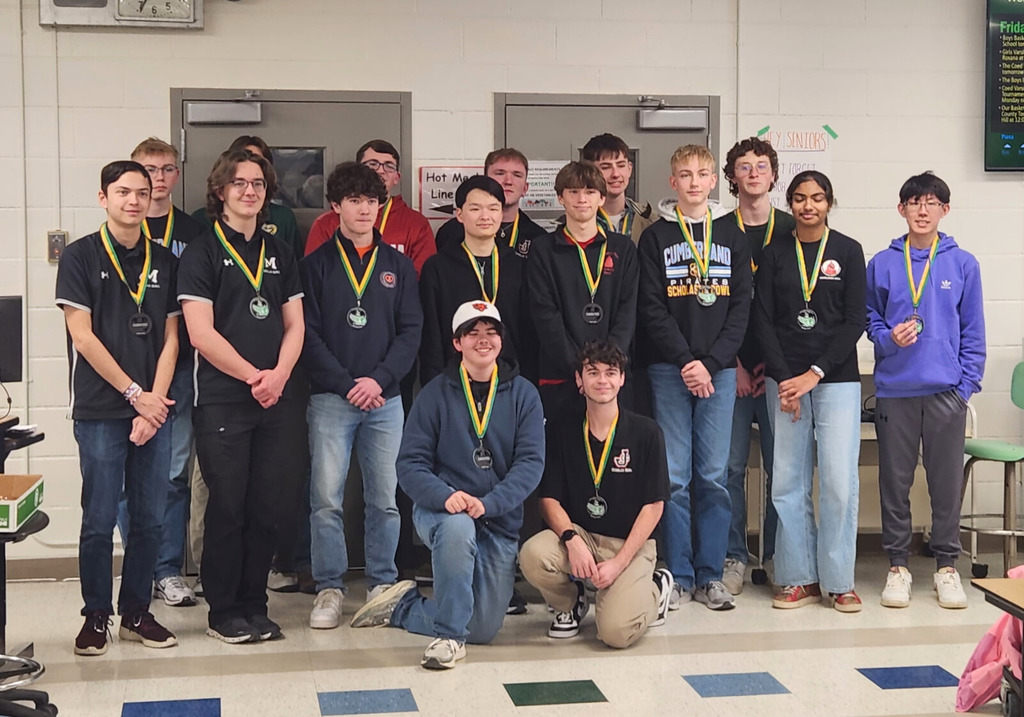 Pictured are the 16 players that were selected to the all-tounament team. Each is wearing a medal. 
