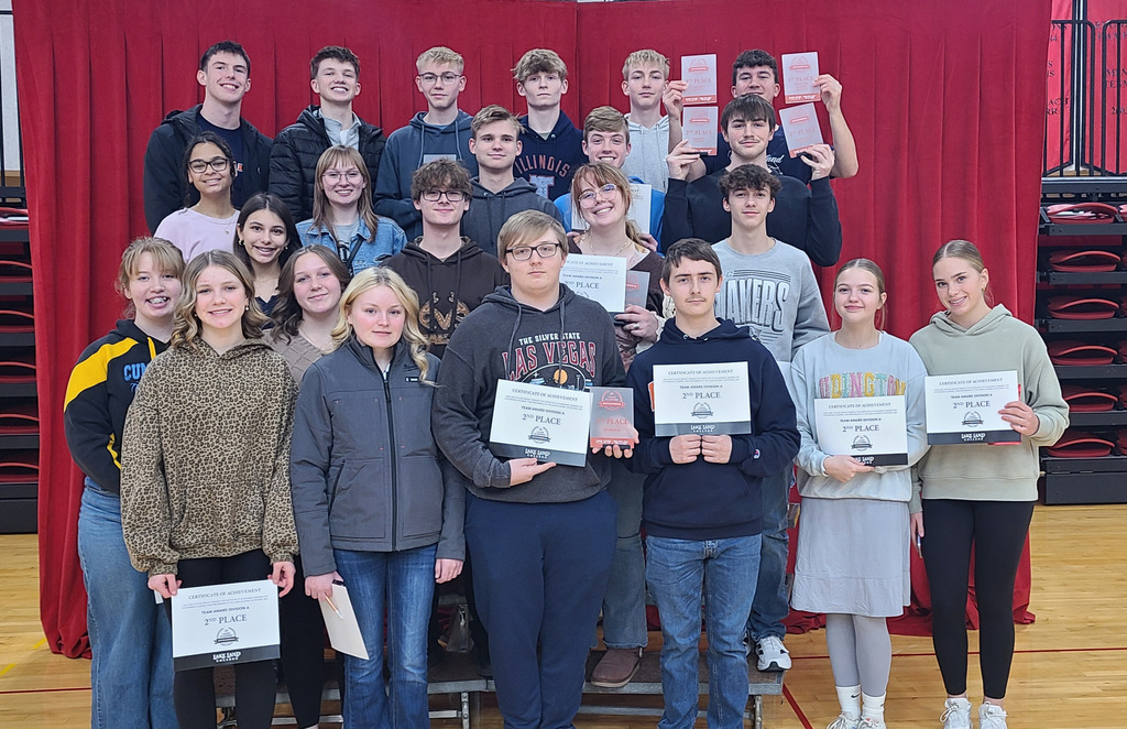 Pictured are the 22 members of the ACES team on risers. They are holding their second place certificates. Individual award winners are holding plaques. 