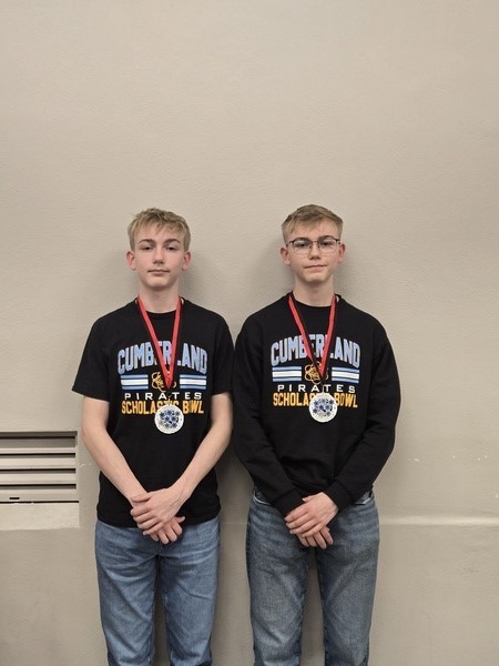 Pictured are CJ and RJ. They are wearing their all-tournament medal. 