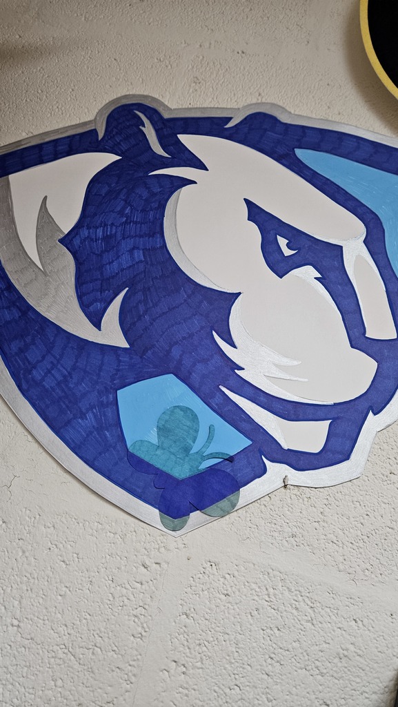 A blue butterfly is blending into a blue, light blue, and white EIU logo.