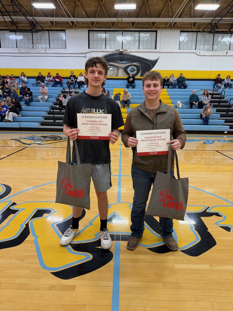Pictured are the two winners. They are each holding their waiver and a bag from Lake Land College. 