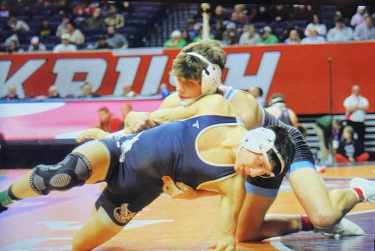 OM has the opponents arms pulled back. He is in the act of turning him  