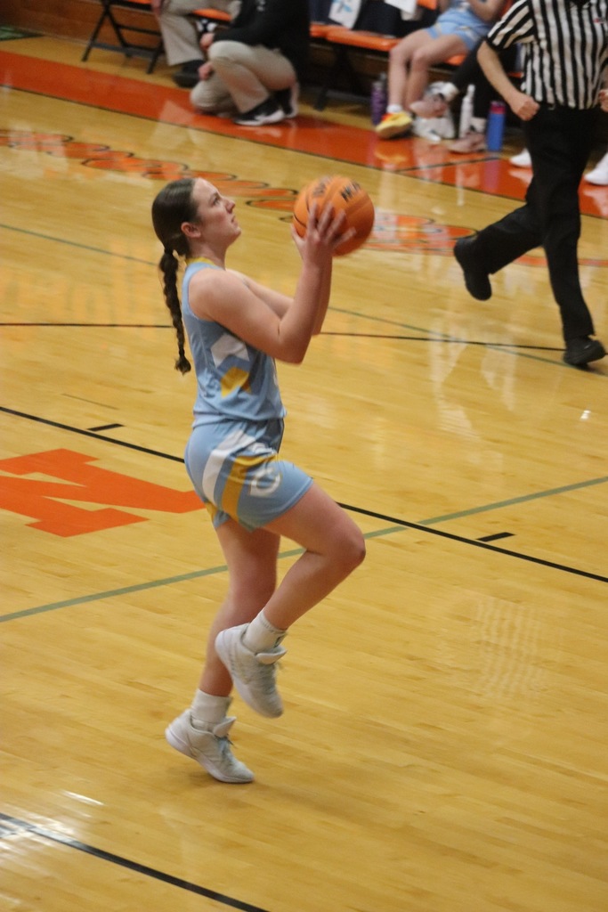 Pictured is AD in the process of making a right-handed layup. There are no other players around.