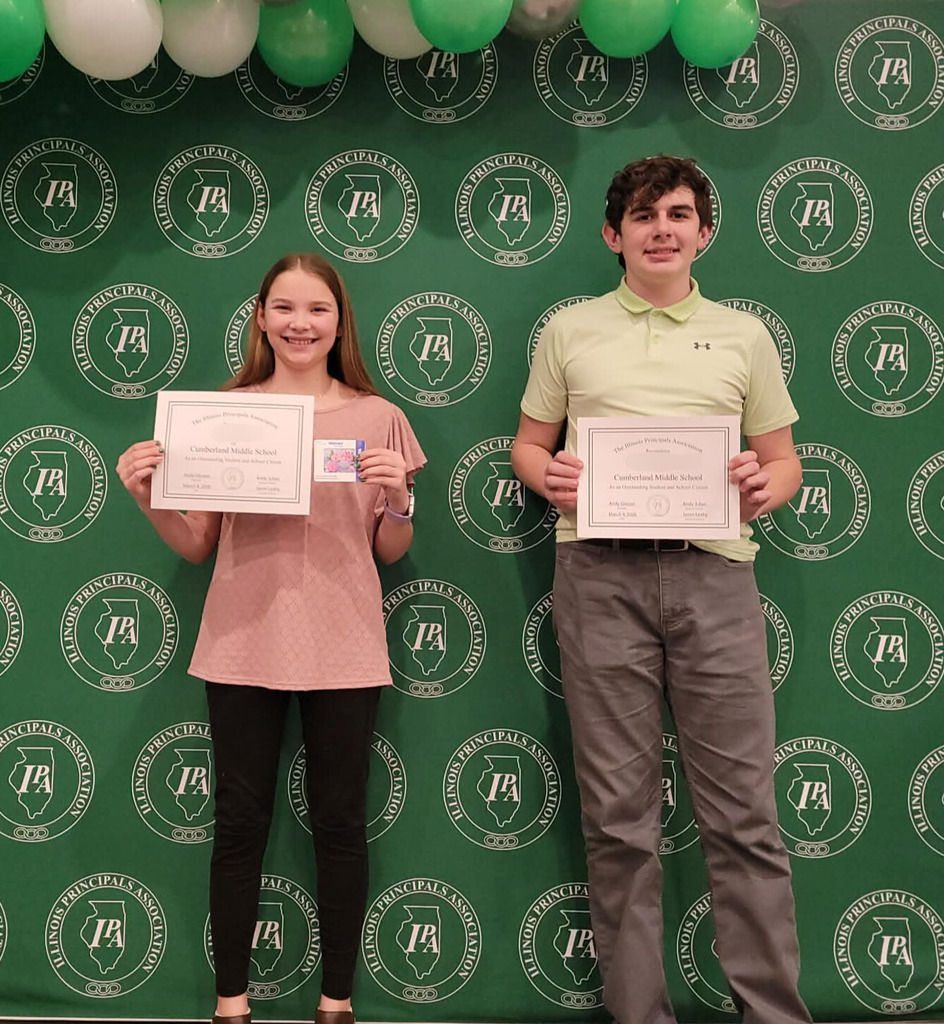 Pictured are two students holding their certificates. 