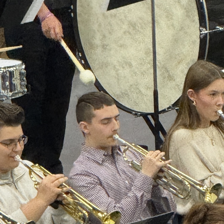 The trumpet section is paying a song. 