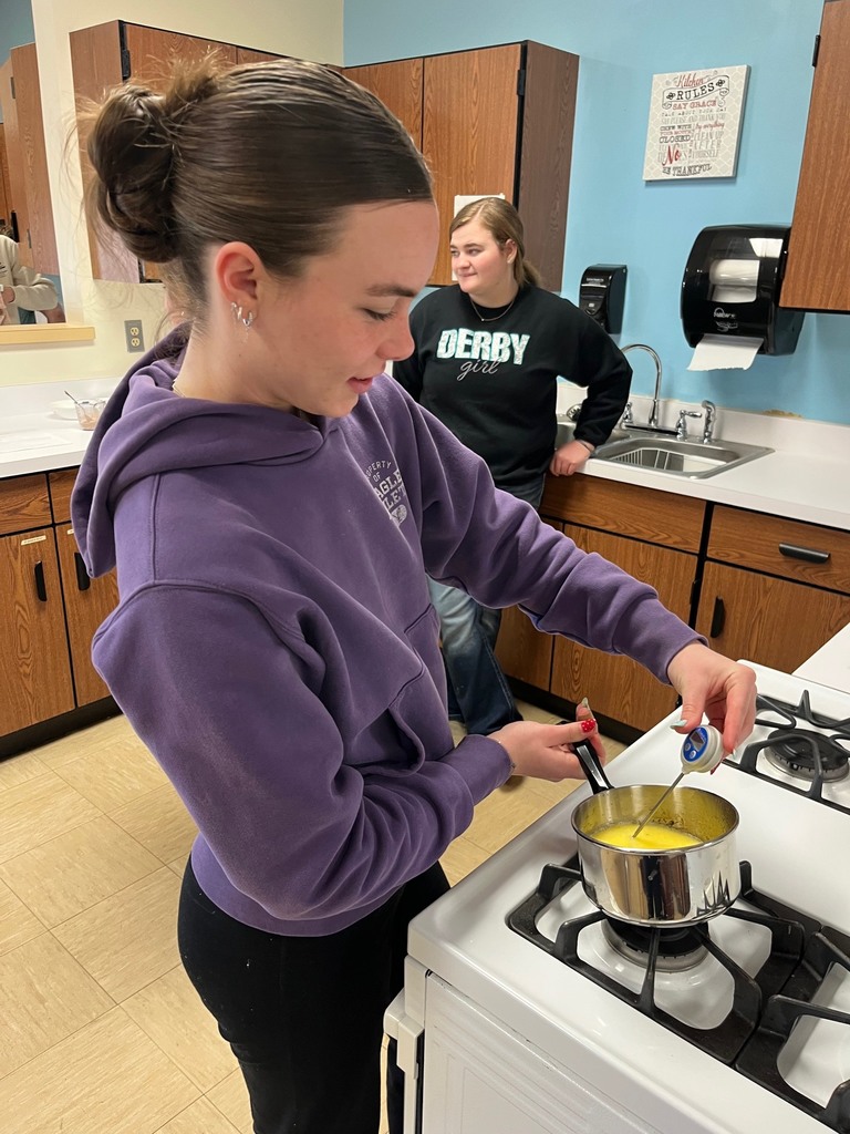 A student is melting butter and watching the temperature. 