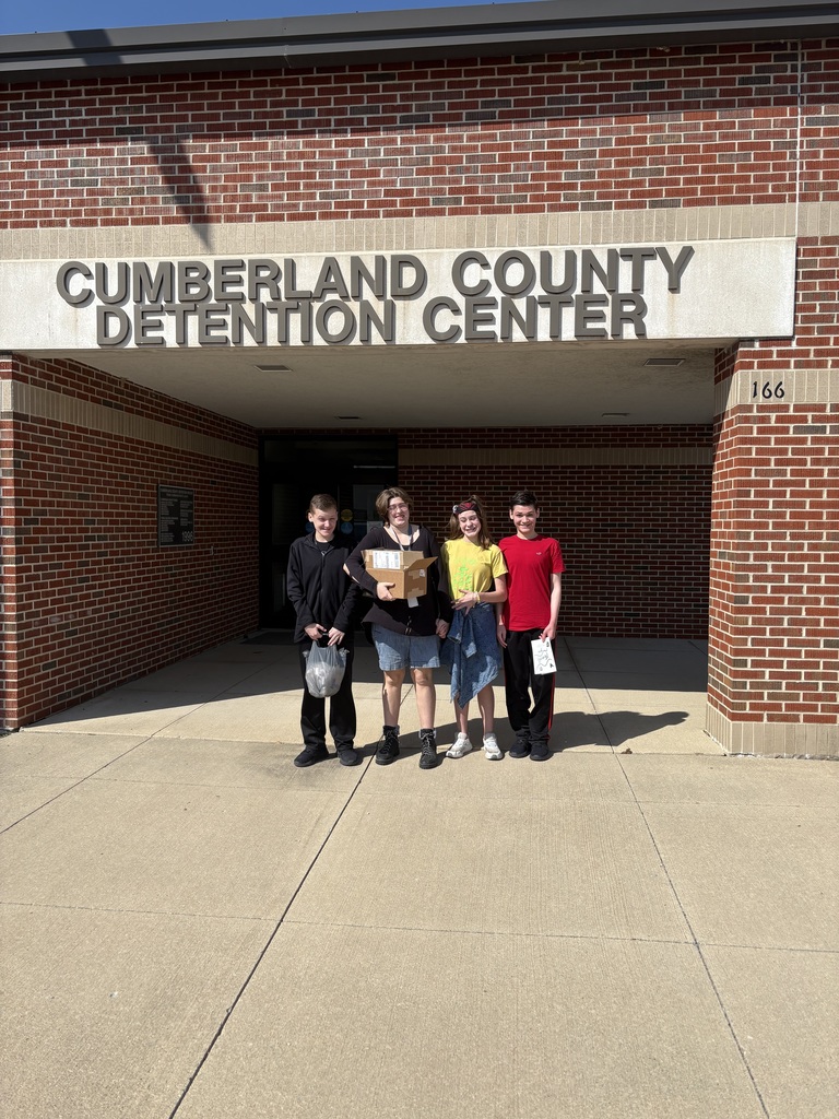 The four students are standing outside of the Cumberland County Detention Center.