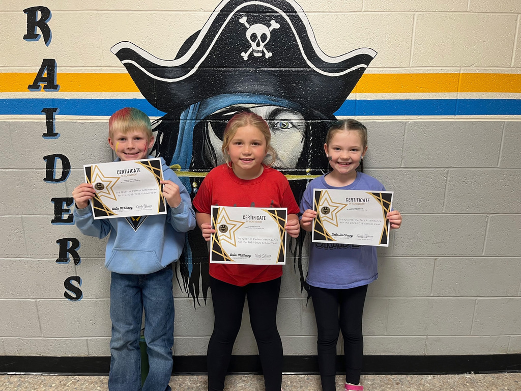 Pictured are three students holding their perfect attendance certificates.